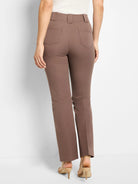 Brown demi bootcut pants, high-waisted with visible stitching on back welt pockets and belt loops.