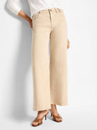 Light tan wide-leg flare jeans, cropped. Classic 5-pocket style with button/zip fly and subtle tonal stitching.