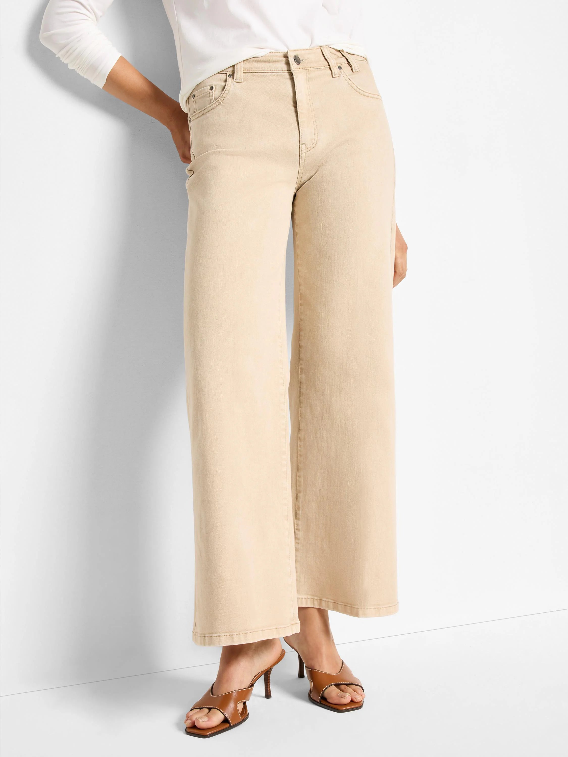 Light tan wide-leg flare jeans, cropped. Classic 5-pocket style with button/zip fly and subtle tonal stitching.