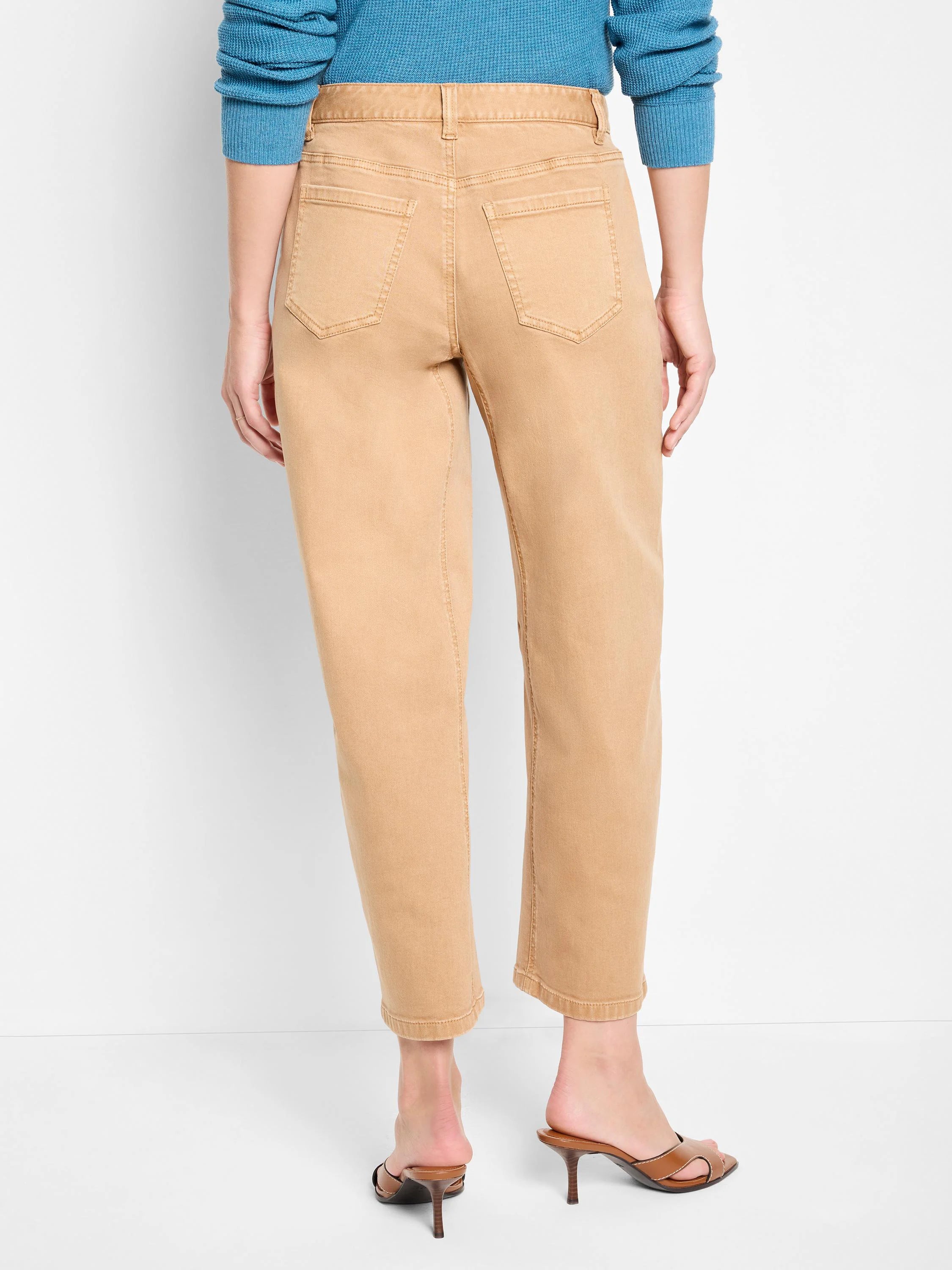 Tan barrel leg jeans, cropped. Seen from behind with back patch pockets and visible stitching.