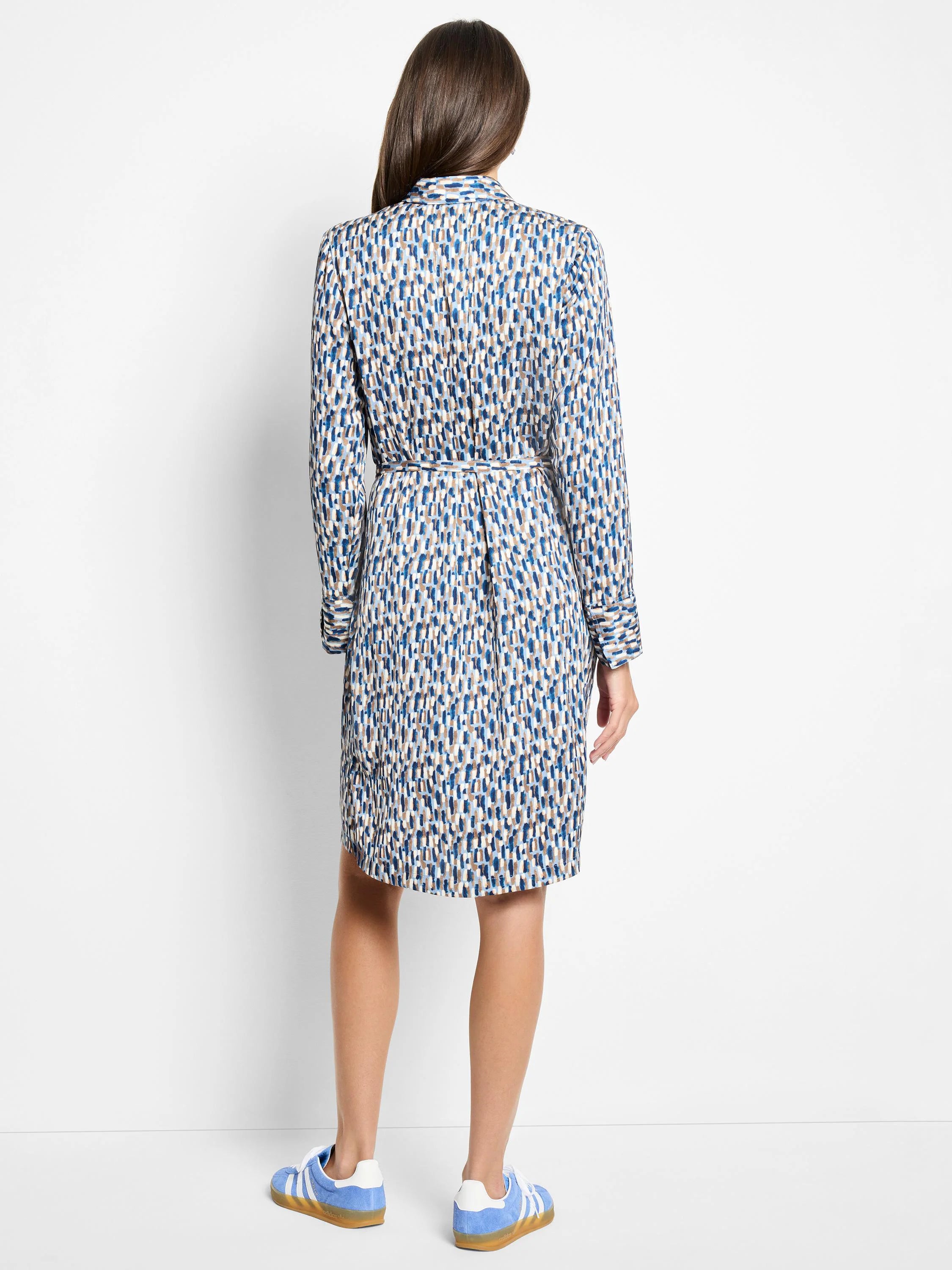 Long-sleeved knee-length dress, belted.  Blue, beige, and white brushstroke pattern.  Back view.