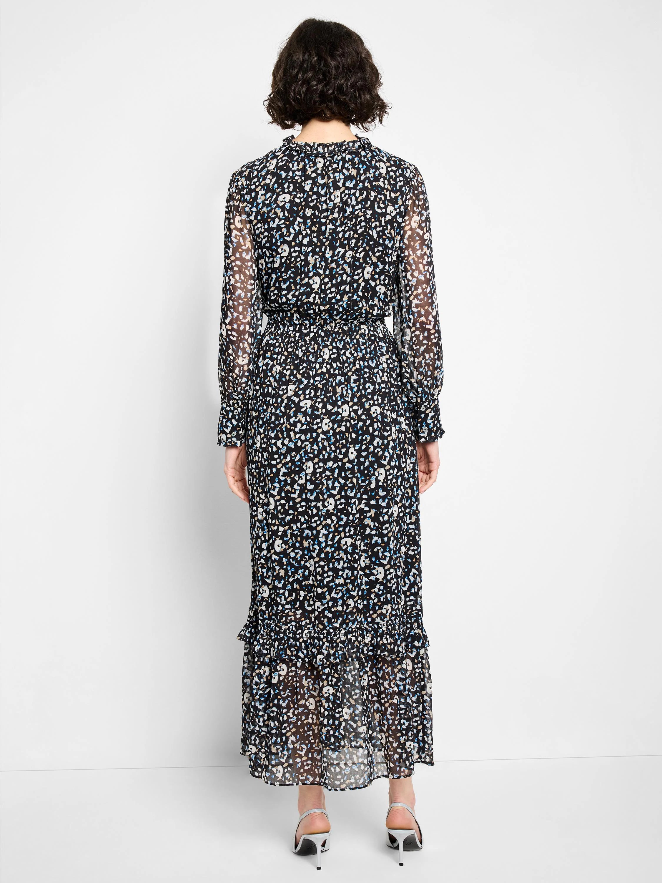 Black maxi dress, abstract blue/white/tan print. Ruffled neck, sheer sleeves, elastic waist, ruffled hem.