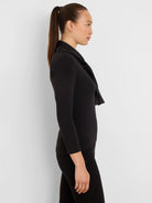Black ribbed top with a dandy tie neckline and long sleeves.