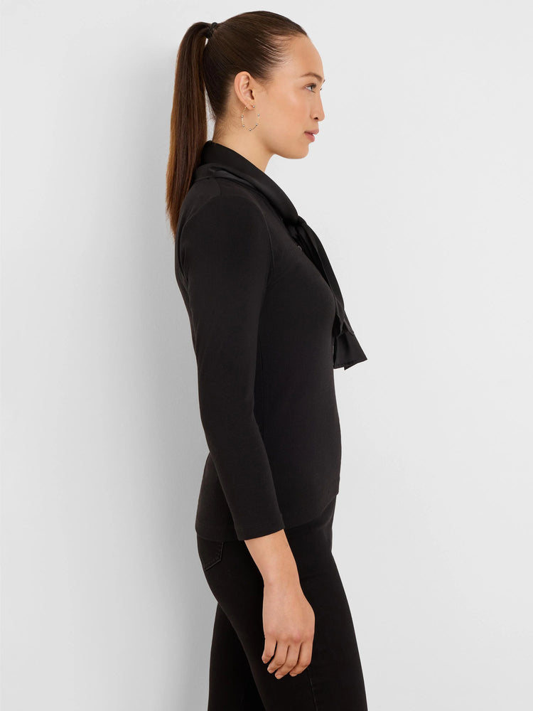 Black ribbed top with a dandy tie neckline and long sleeves.