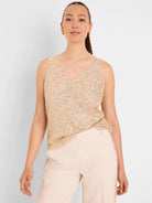 Sleeveless champagne sequin knit tank top with a V-neck.