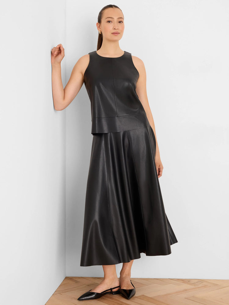 Black vegan leather sleeveless top with a round neck and a tiered hem.