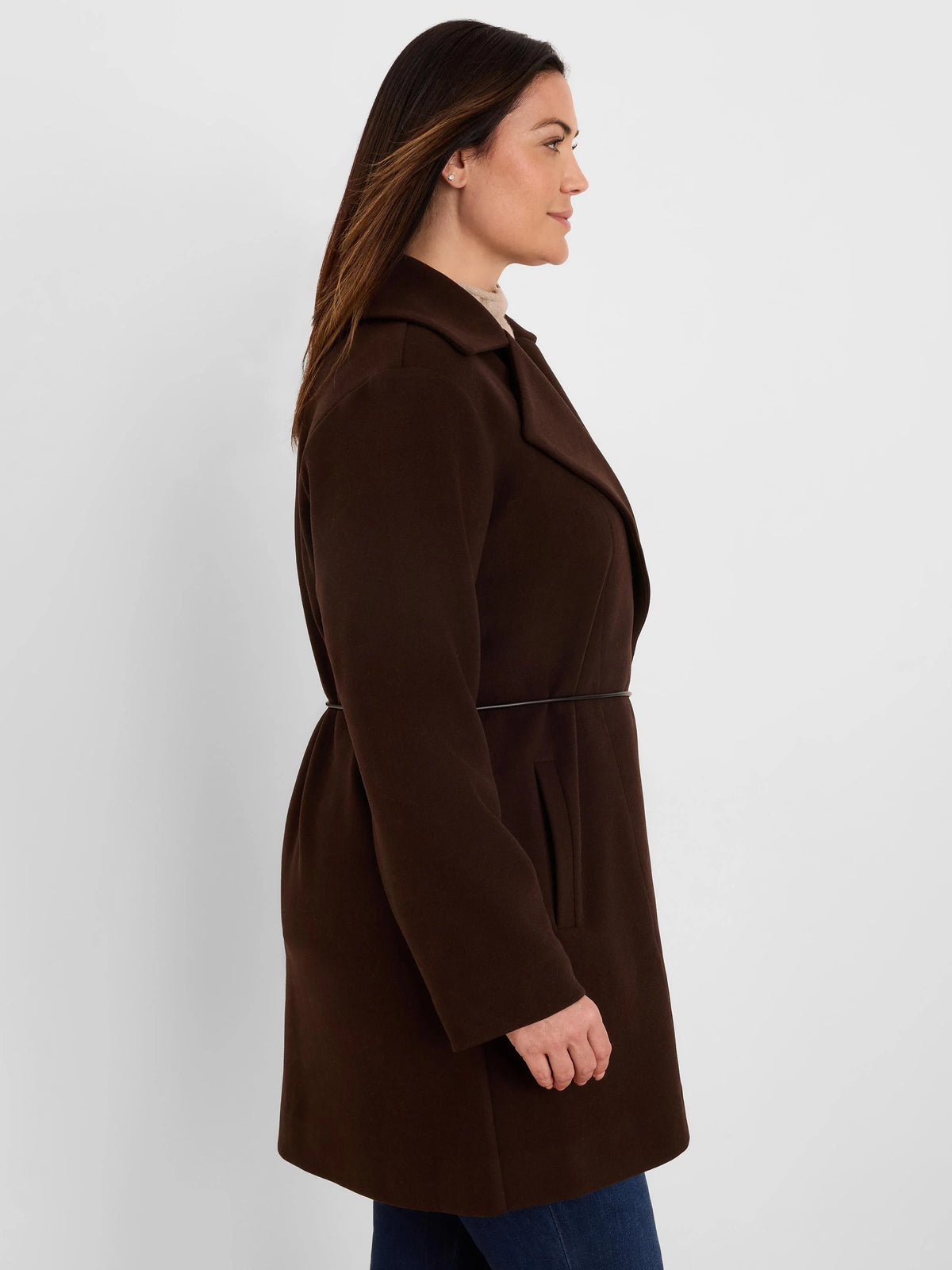 Dark brown wrap jacket with lapel collar, long sleeves, and thin black tie belt, shown mid-thigh.