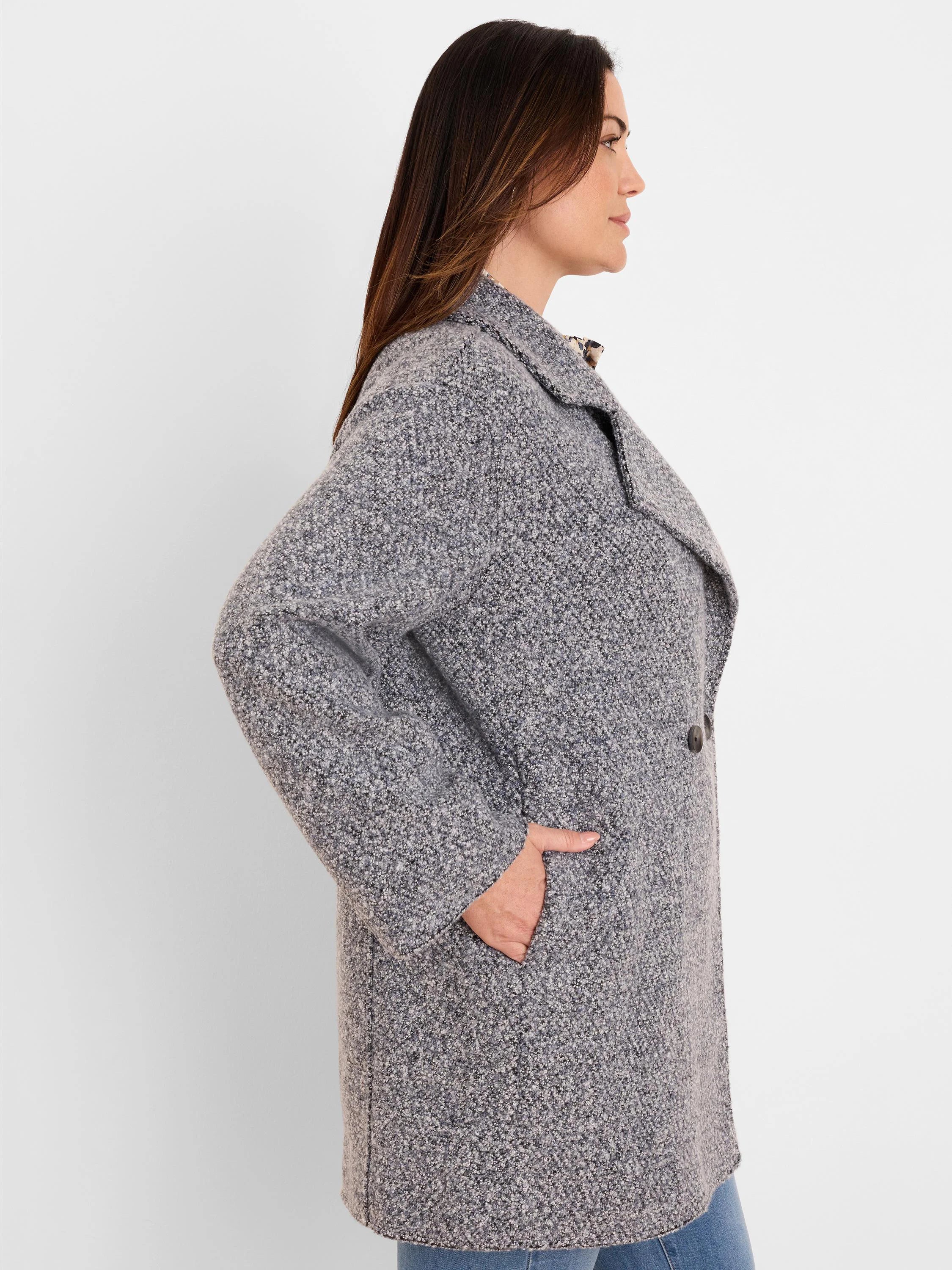 Flecked grey boucle knit jacket with wide lapels, front buttons, and side pockets.