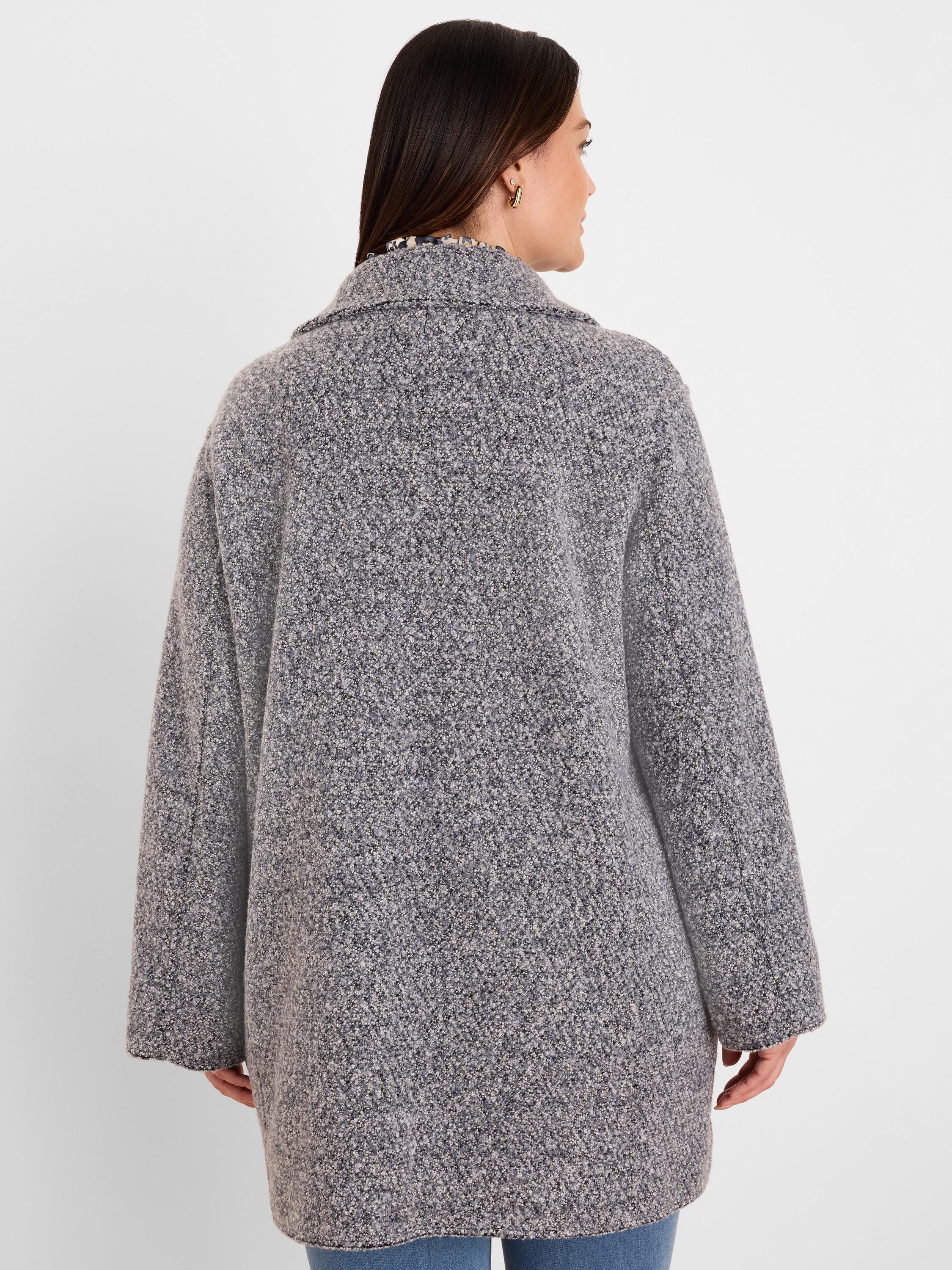 Grey and black mixed boucle knit jacket, back view. Features visible loops, long sleeves, and mid-thigh length.