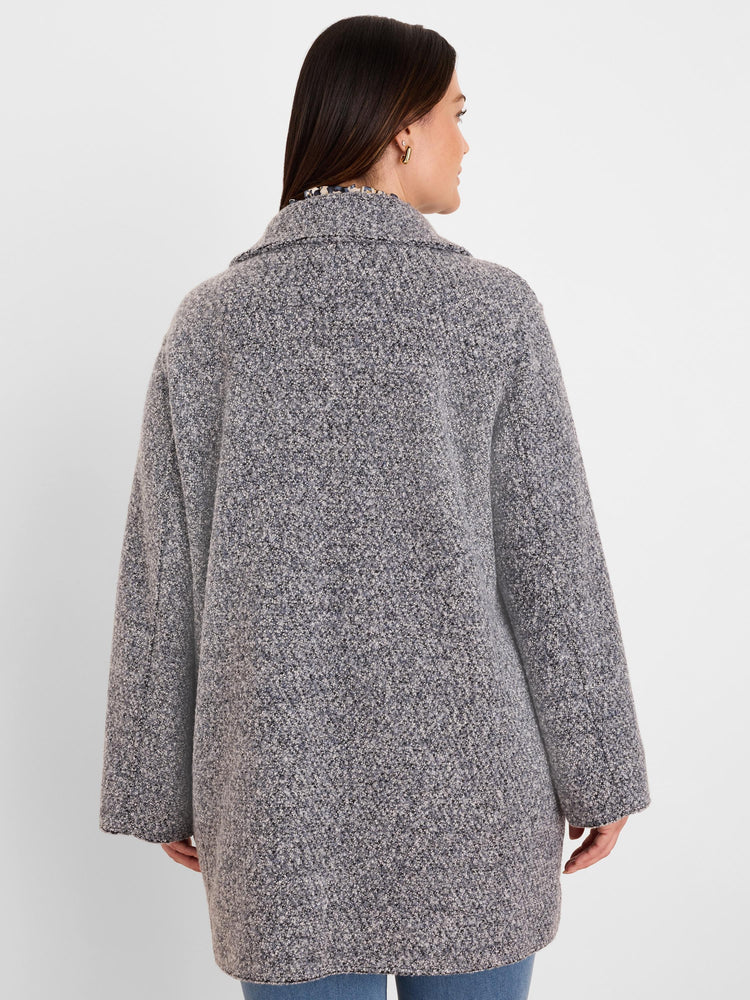 Grey and black mixed boucle knit jacket, back view. Features visible loops, long sleeves, and mid-thigh length.