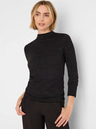Black mock neck top with subtle silver sparkle, 3/4 sleeves, and ruched sides.