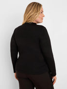 Black long-sleeve top with a shimmering finish and a high neckline.