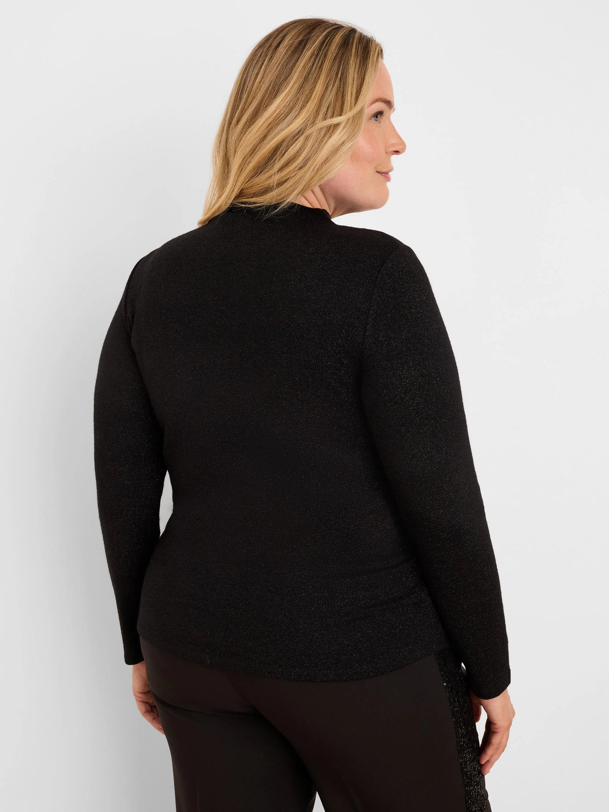 Black long-sleeve top with a shimmering finish and a high neckline.