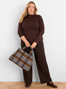 Fitted dark brown top with subtle sparkle, boat neck, and 3/4 sleeves.
