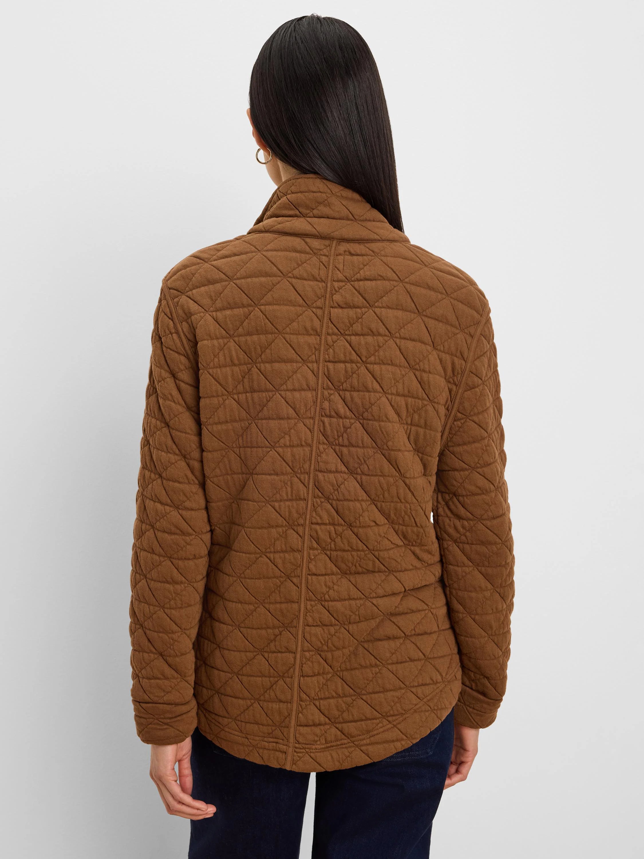 Brown quilted jacket with a diamond pattern, shown from the back on a model.