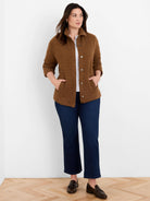 Brown quilted knit jacket with diamond pattern, silver snap buttons, shirt collar, and patch pockets.