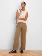 Sleeveless cream ribbed knit tank top.