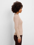 Oatmeal ribbed knit long-sleeve polo shirt with a collar, fitted.