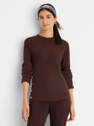 Dark brown waffle knit top with a crew neck and gold buttons along the left side.