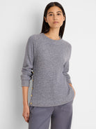 Grey waffle knit top with long sleeves, crew neck, and gold buttons down the left side.