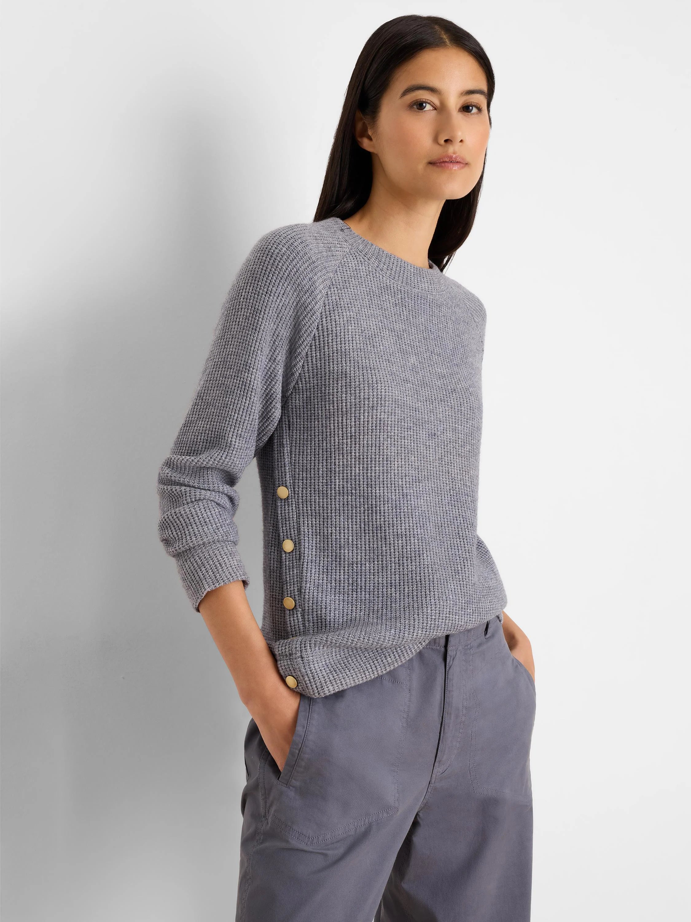 Light grey waffle knit top with a crew neck, long sleeves, and gold buttons along the left side.