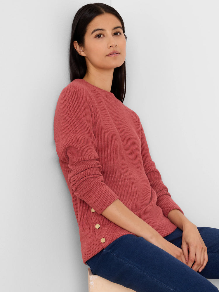 Terracotta ribbed waffle top with three gold side buttons.