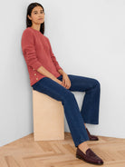 Rose waffle knit top with gold buttons along the side hem, worn by a model.