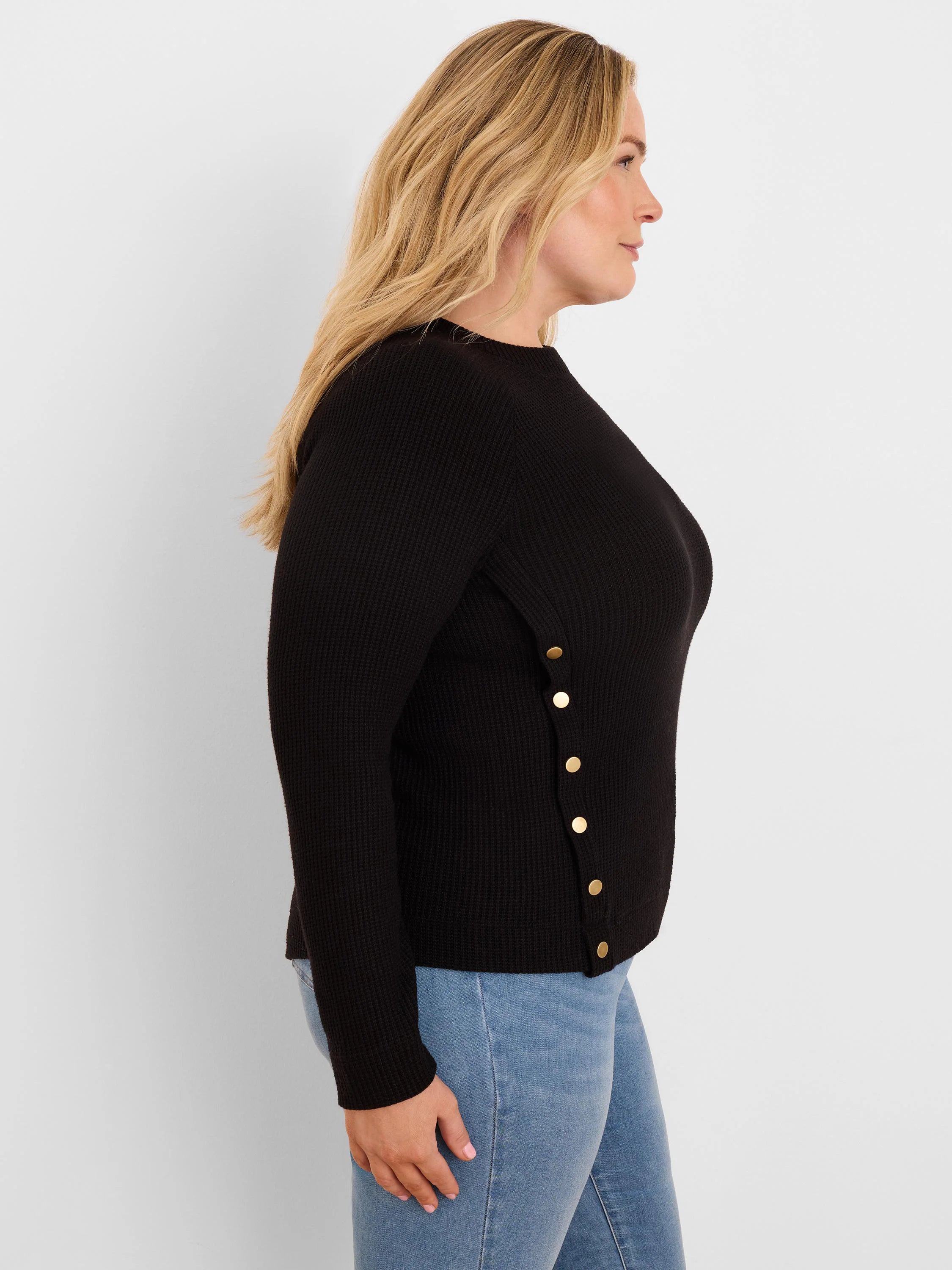 Black waffle knit top with gold-toned buttons vertically down the left side.