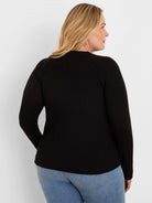 Black waffle knit long-sleeve top with a crew neck, viewed from the back.