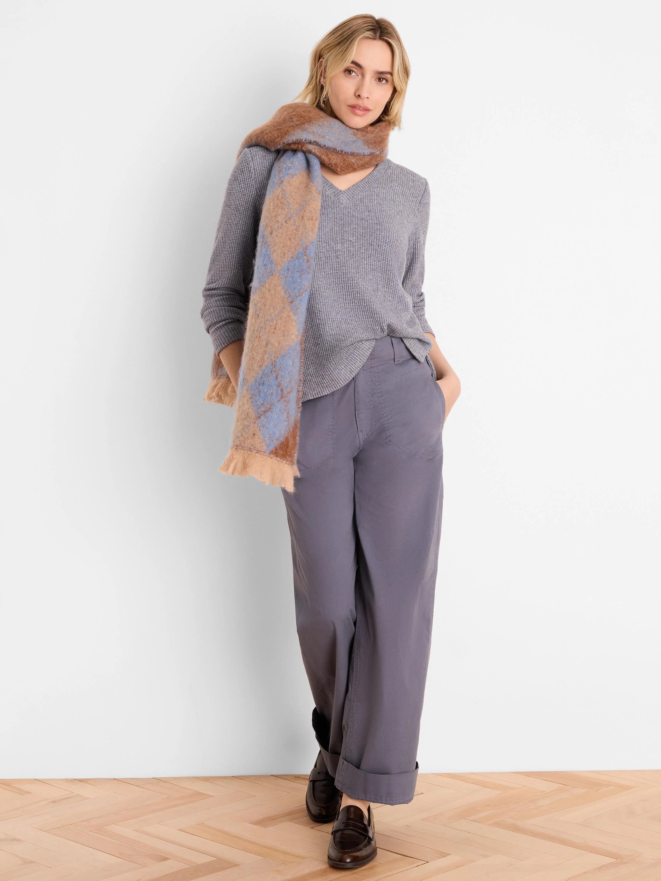 Light grey V-neck waffle knit top with long sleeves, relaxed fit.
