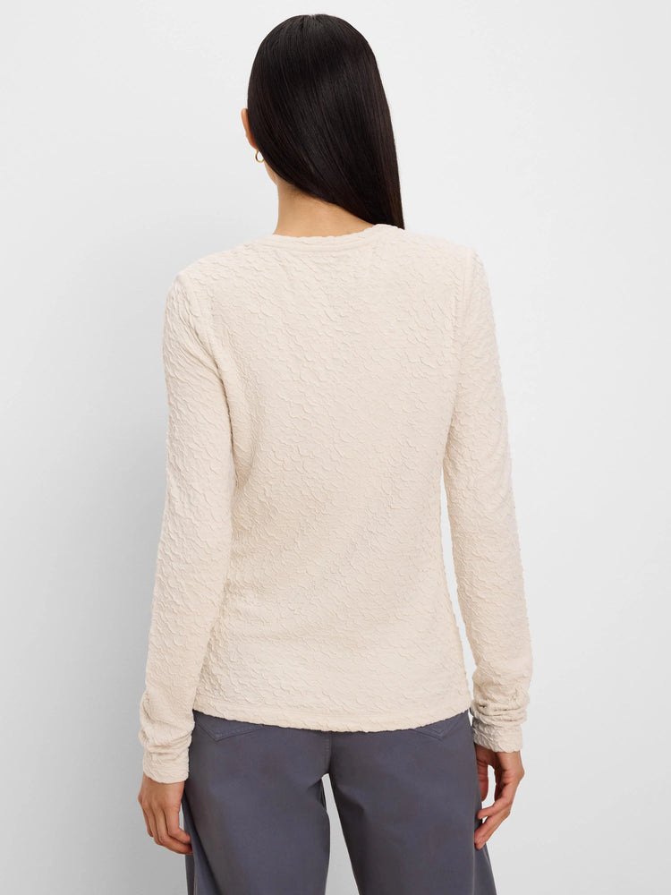 Cream crinkle knit long-sleeve top, all-over wavy texture, back view on model.
