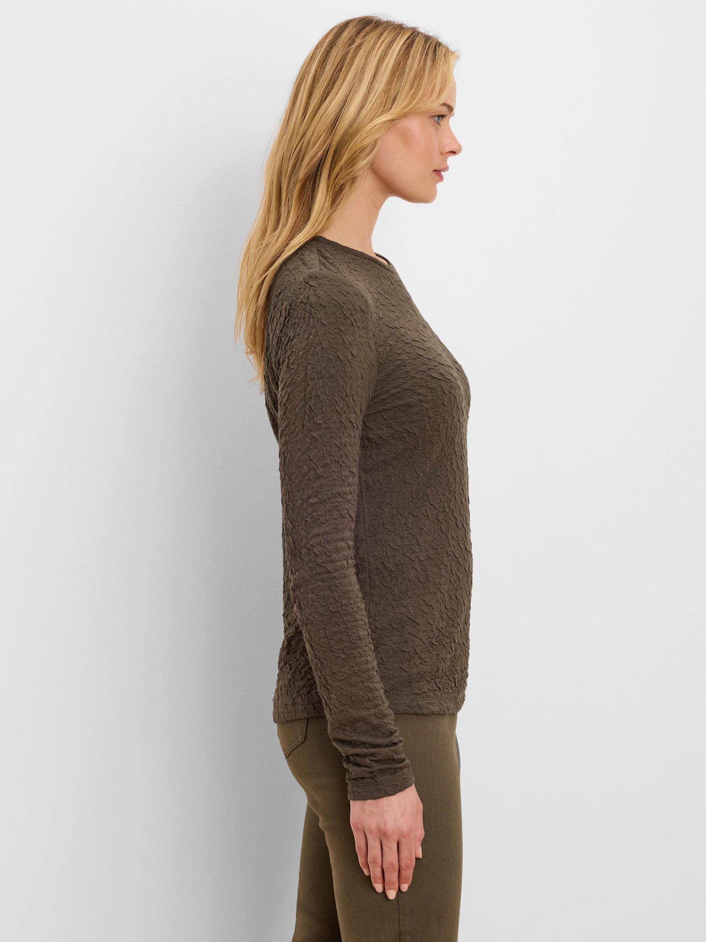 Dark olive green crinkle knit long-sleeve top.