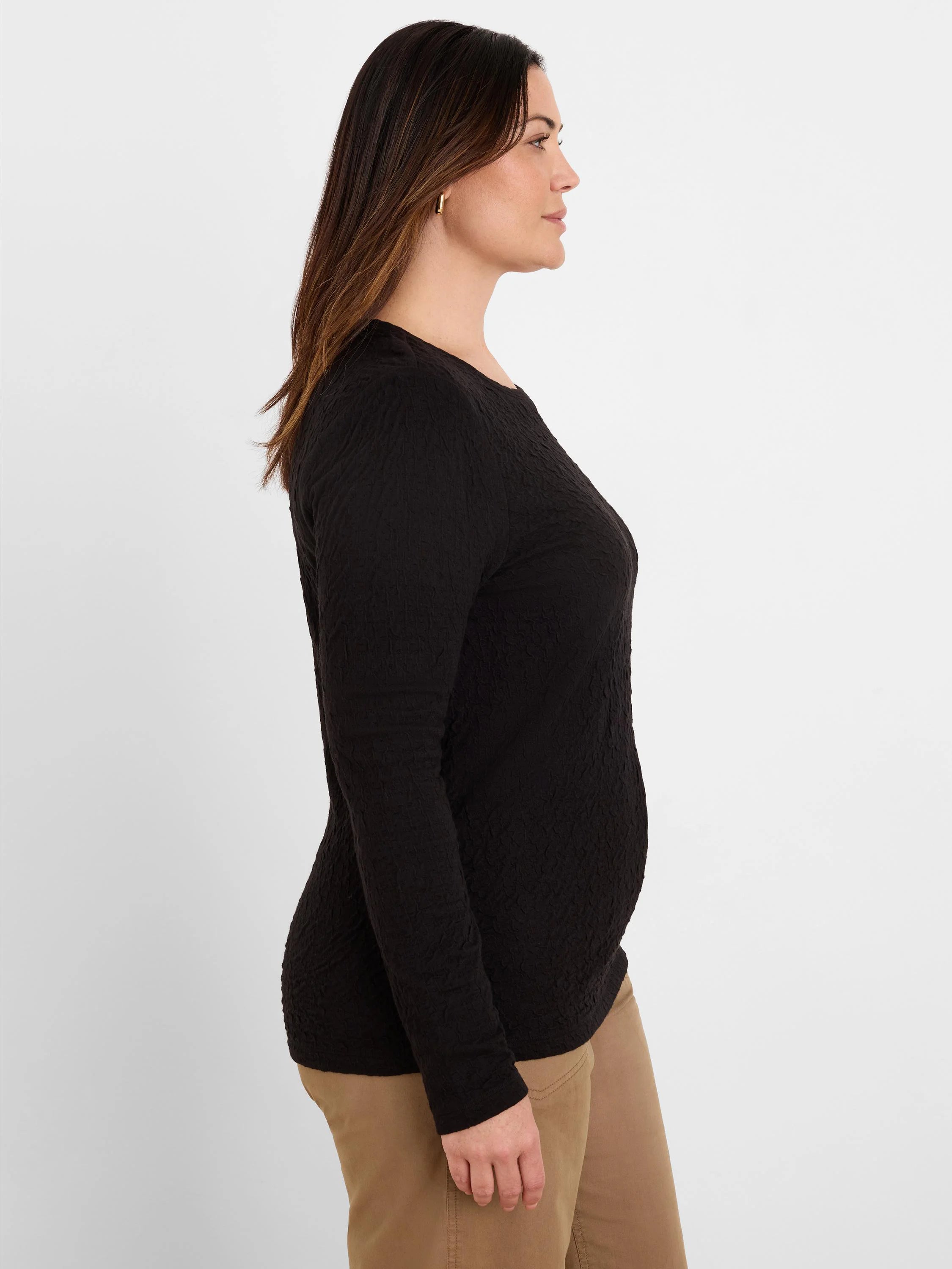 Black crinkle knit textured long-sleeve top.