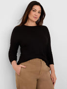 Black textured crinkle-knit top with a boat neck and 3/4 sleeves.