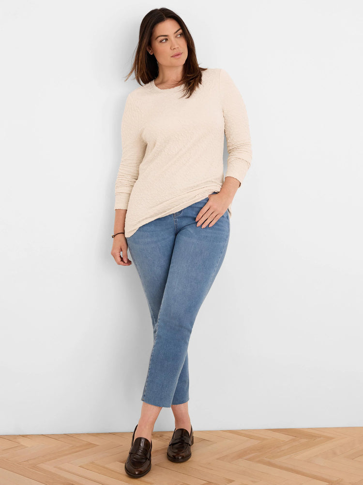 Cream crinkle knit long-sleeve top.
