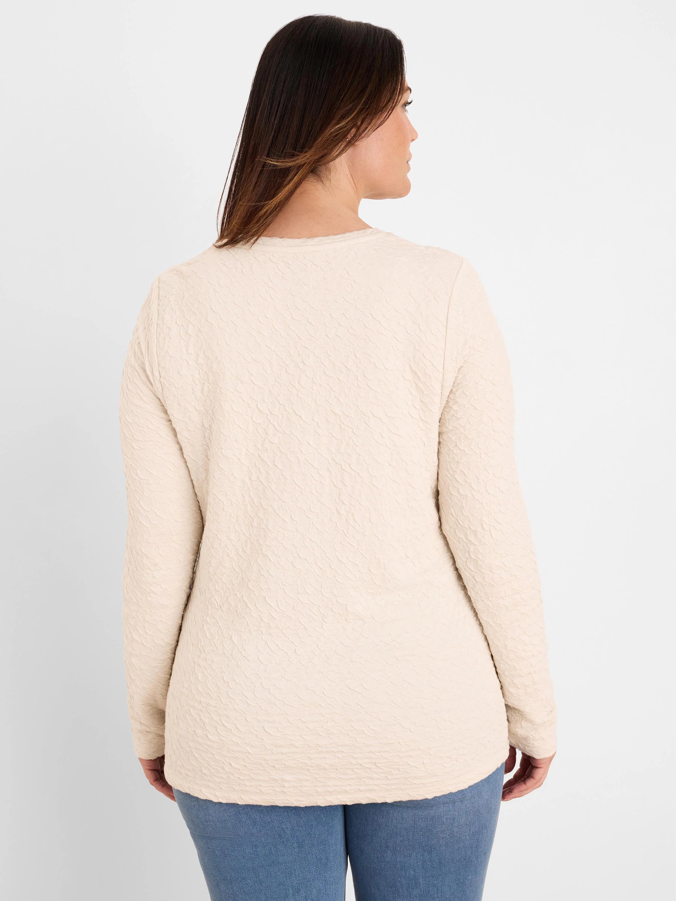 Oatmeal crinkle knit top with a subtle wavy texture and long sleeves, shown from the back on a model.