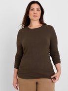 Dark olive brown crinkle knit top with long sleeves and a distinct wavy texture, modeled.
