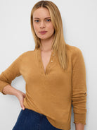 Camel Henley sweater with a 3-button placket and ruffle-edged 3/4 length sleeves.