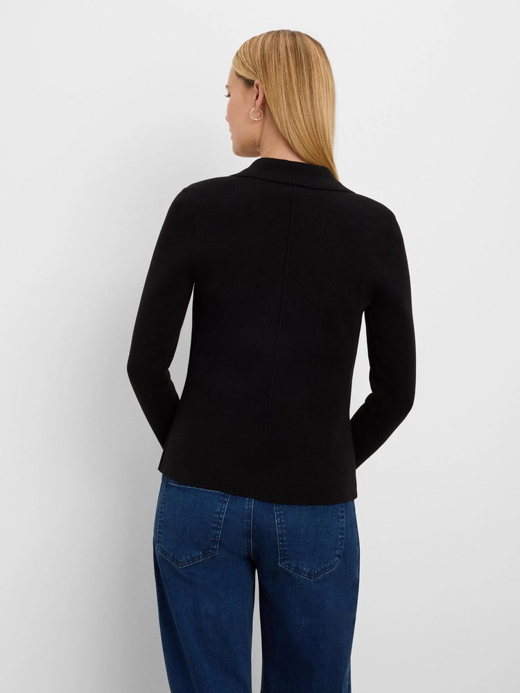 Black blazer, back view on model. Features ribbed knit texture, long sleeves, and a lapel collar.