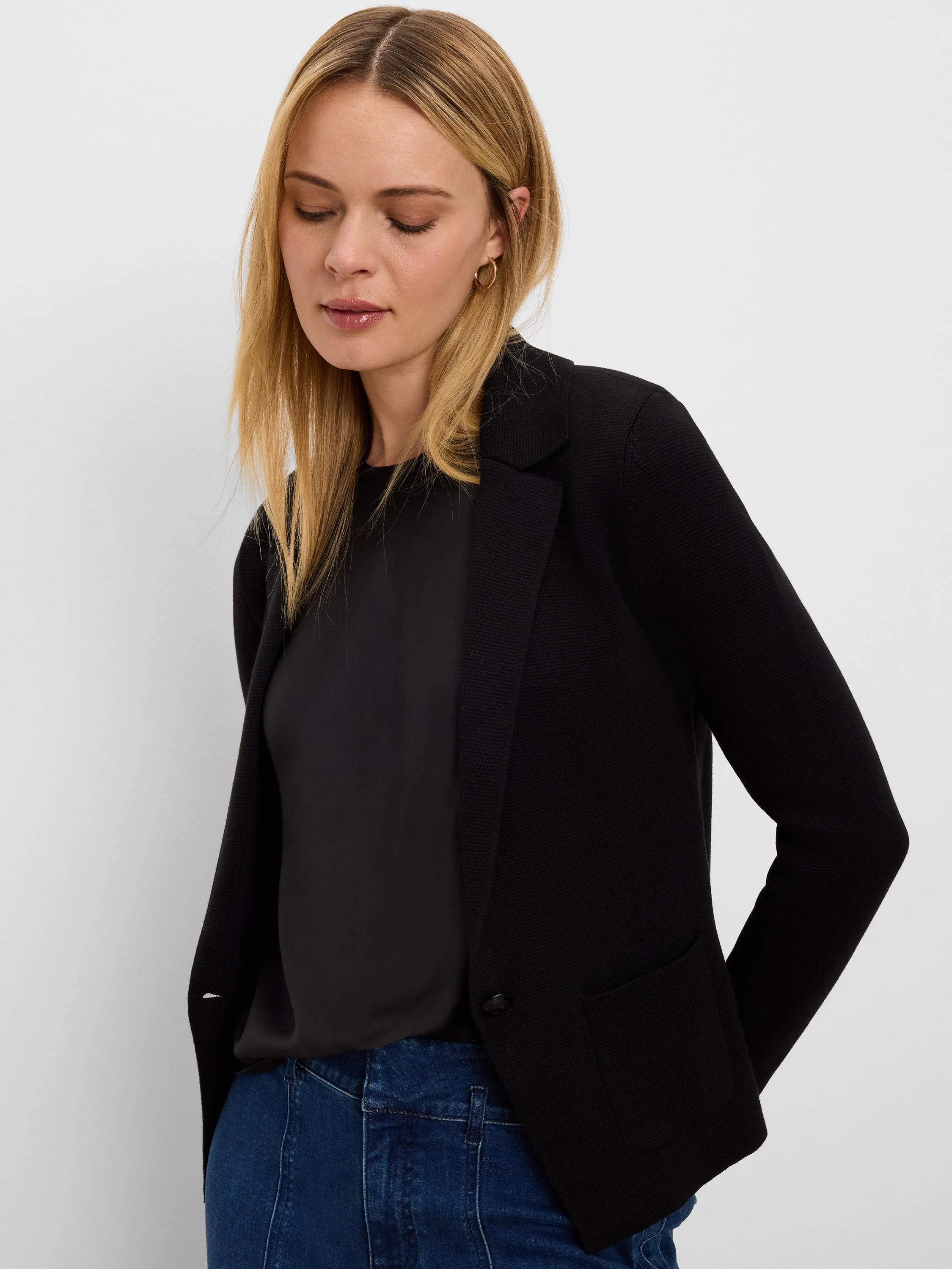 Black knit tailored blazer with lapel collar, single button closure, and front patch pockets.