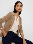Tan knit blazer with tailored lapels, visible textured weave, shown open.