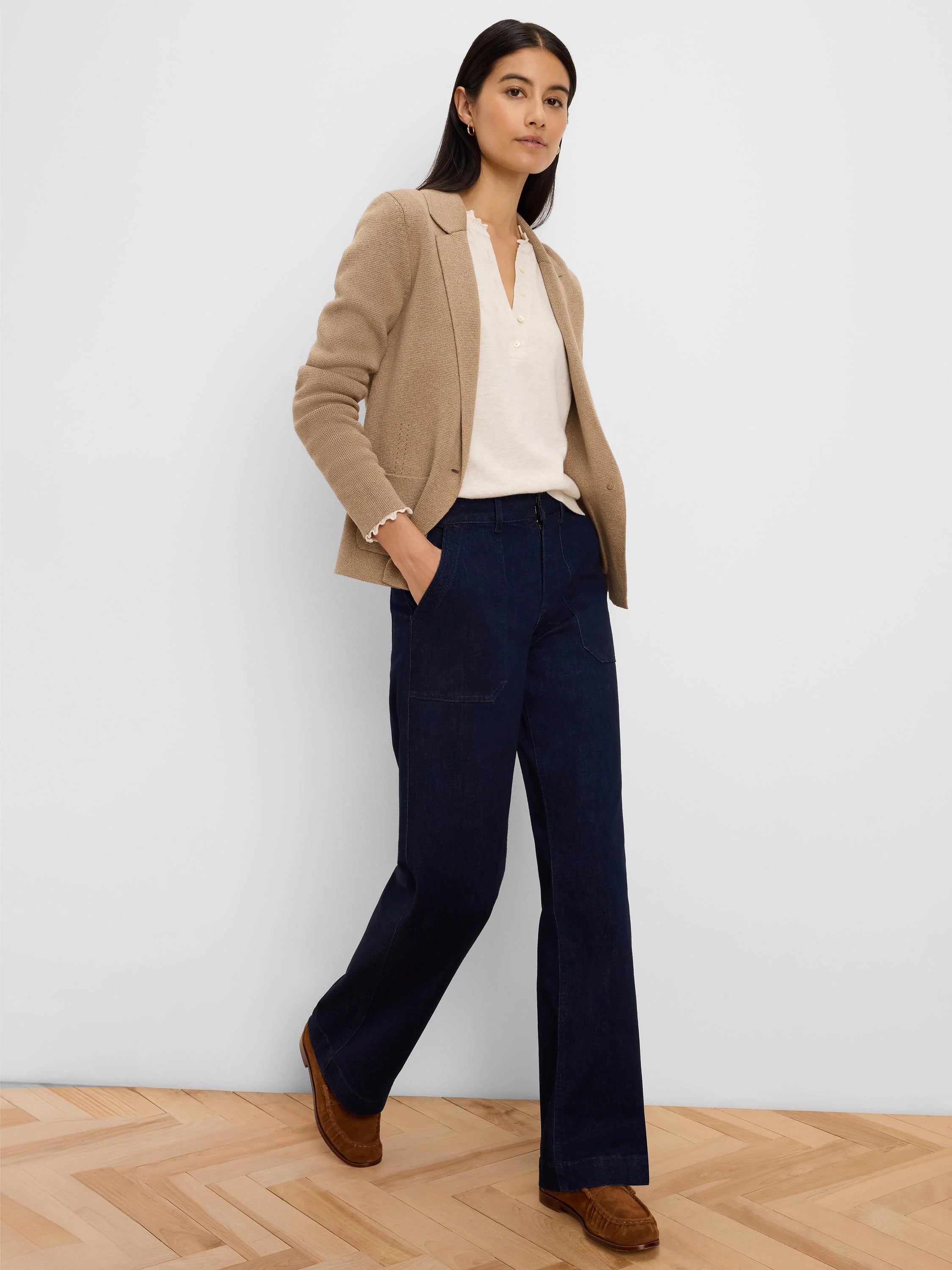 Tan knit tailored blazer with notched lapels and front patch pockets.