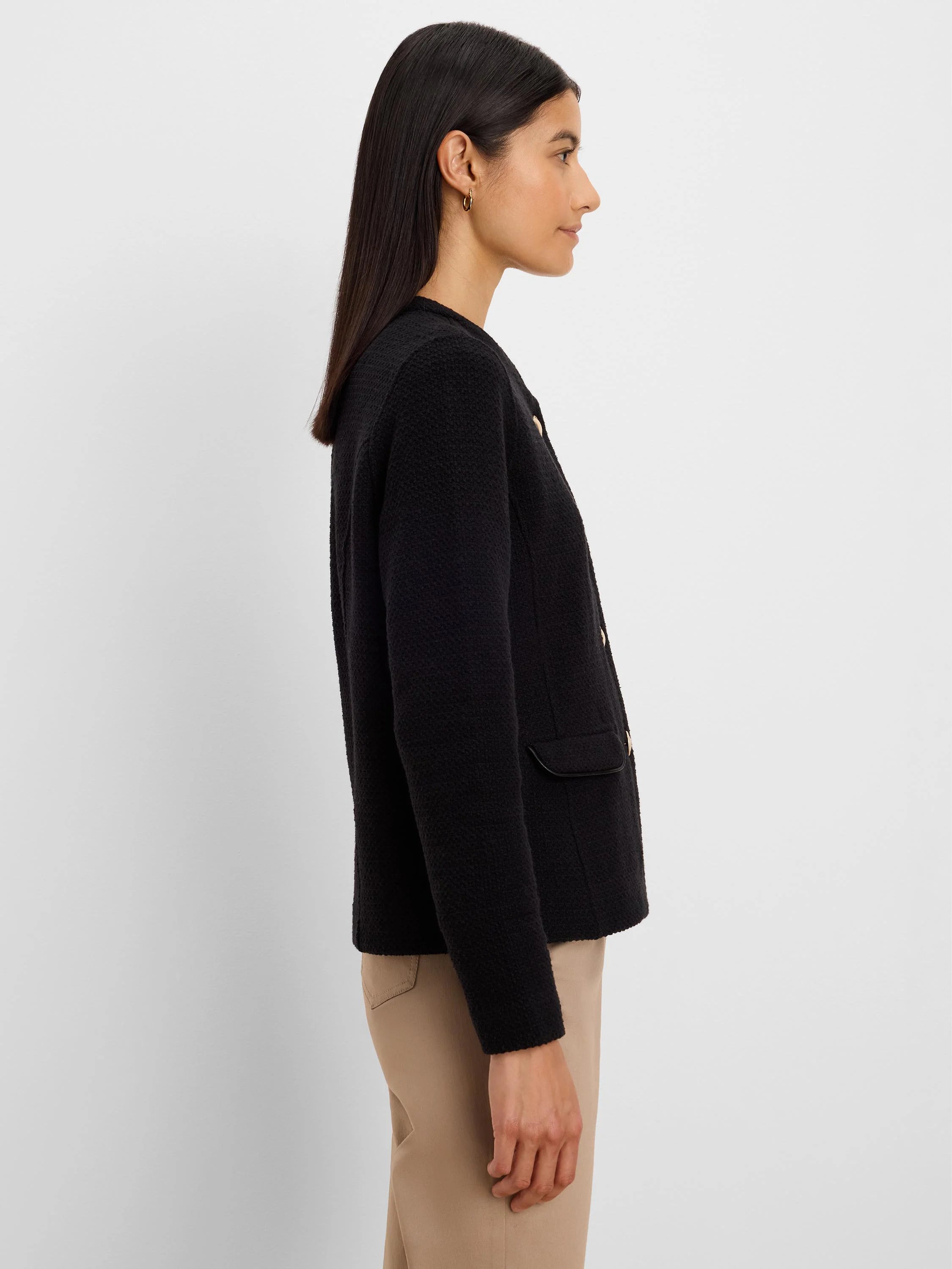 Black textured knit jacket with gold buttons and trimmed flap pockets.
