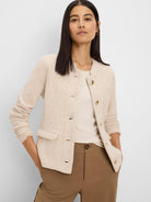 Oatmeal textured knit jacket, collarless, with subtle cream trim, gold buttons, and patch pockets.