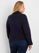 Navy blue knit jacket with a standing collar, vertical back seam, and a relaxed fit.