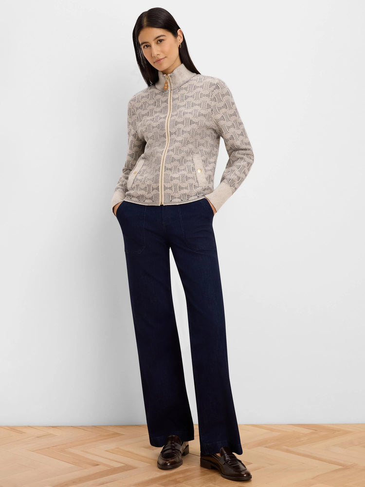 Beige knit jacket with dark swirl pattern, full gold zip, stand collar, and two buttoned pockets.