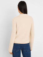 Cream velvet cord knit jacket with a textured, fuzzy surface and ribbed collar, seen from the back.