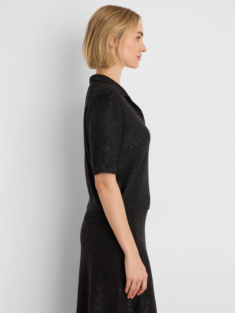 Black short-sleeved knit polo sweater with a collar, detailed with scattered sequins.