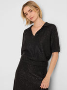 Black sequin short-sleeved polo sweater with a V-neck polo collar, and ribbed cuffs and hem.