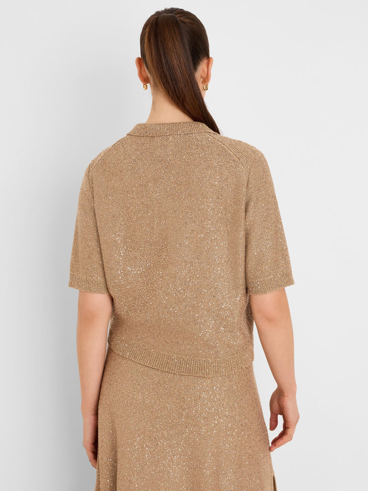 Tan sequin knit polo sweater with short sleeves and collar, featuring tiny shimmering sequins throughout. Back view.